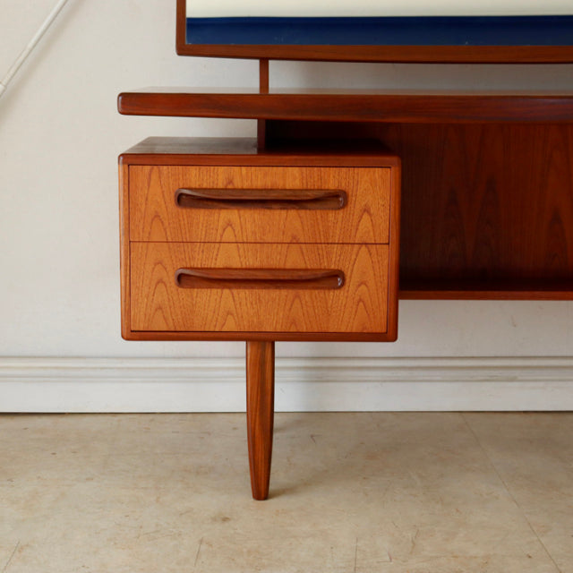 Vintage G-plan teak desk drawer unit with two curved handles, tapered leg, mid-century British design inspired by Danish.