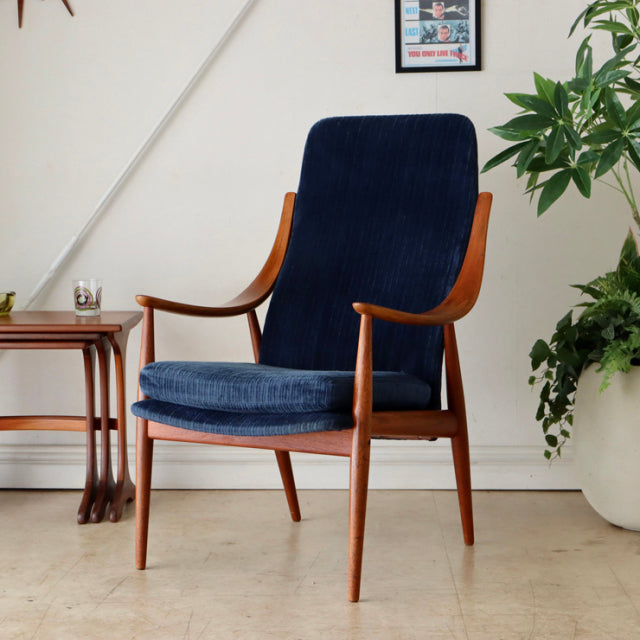 Mid-century vintage teak highback chair by Peter Hvidt & Orla Molgaard-Nielsen, deep blue upholstery, sleek wooden armrests.