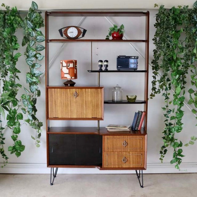 Vintage mid-century teak room divider with British-Denmark design, featuring wood grain cabinet doors and iron hairpin legs.