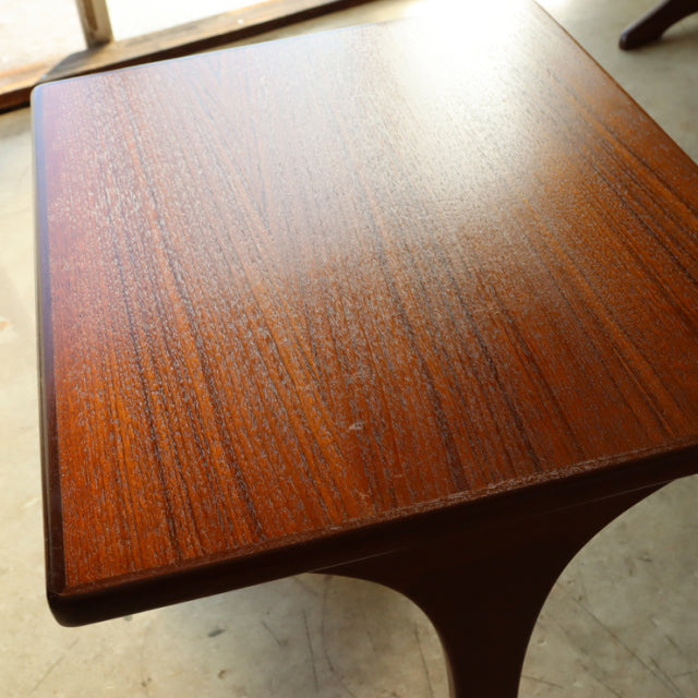 Vintage teak G-Plan British mid-century nesting table top showing rich wood grain and smooth finish.