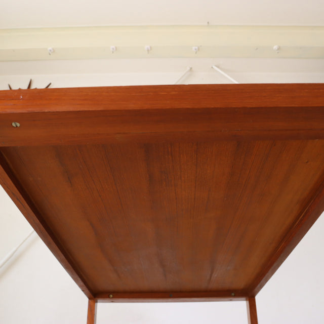 Mid-century British vintage teak coffee table bottom view showing rich wood grain and sturdy square legs from Denmark design.