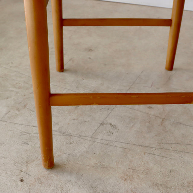Mid-century British vintage teak dining chair legs with smooth wood grain and light natural finish.