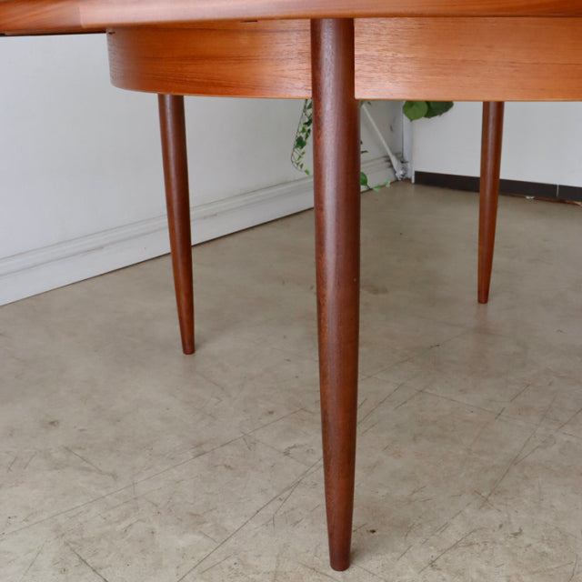 Mid-century British vintage teak dining table leg with tapered cylindrical design and rich wood grain from G-PLAN Fresco.