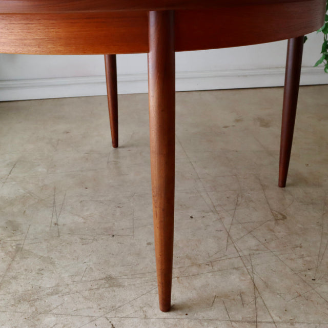 Vintage teak G-Plan dining table leg with smooth wood grain in British mid-century Denmark style.
