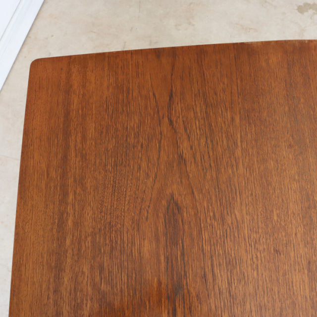 Vintage mid-century teak dining table top with warm wood grain and smooth finish, British-Denmark style.