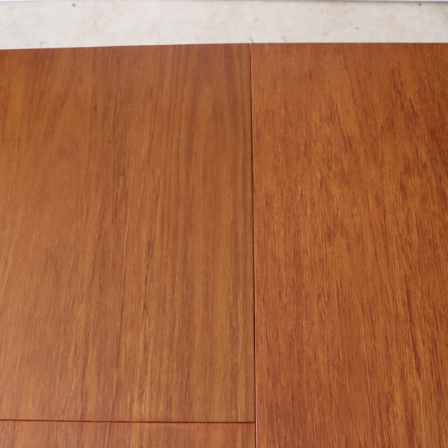 Oval vintage teak dining table top with rich wood grain and mid-century British design details.