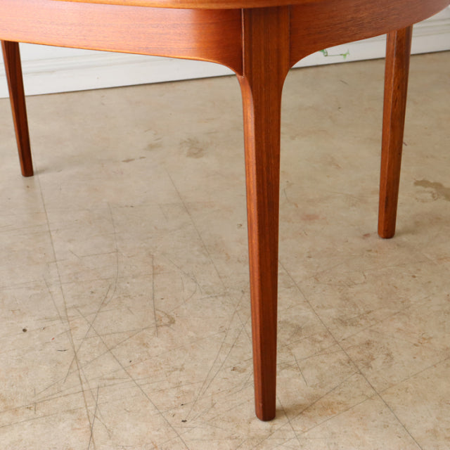 Vintage mid-century teak dining table leg with tapered design and smooth wood grain, British-Denmark style.
