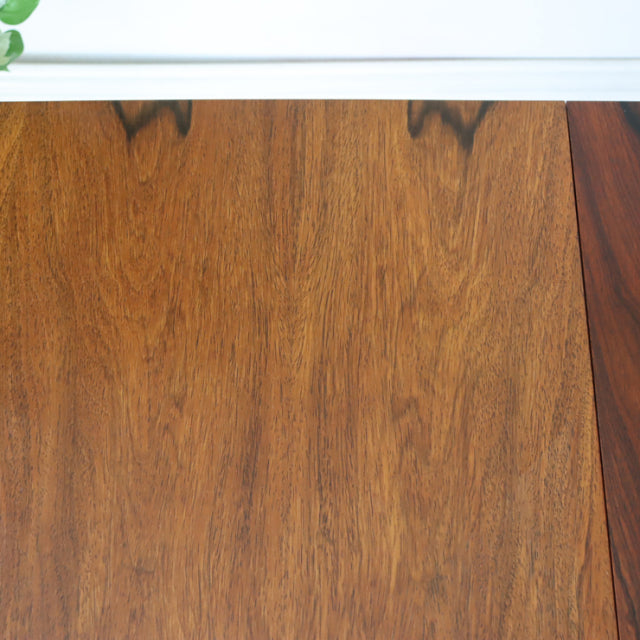 Vintage mid-century McIntosh dining table in rich teak with smooth wood grain and clean rectangular top edges.