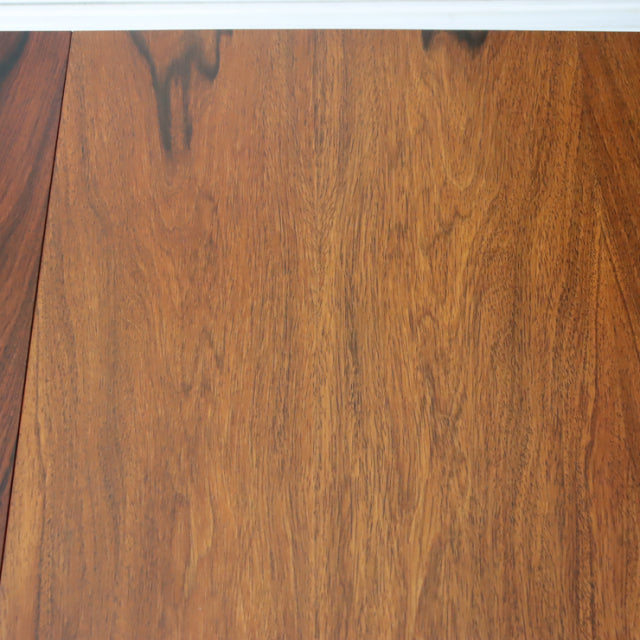 Vintage McIntosh mid-century teak dining table surface showcasing rich wood grain with warm tones and smooth finish.