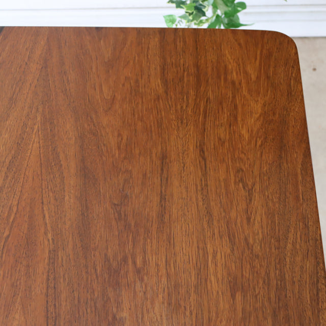 Mid-century vintage British teak dining table top with rich wood grain and rounded corners.