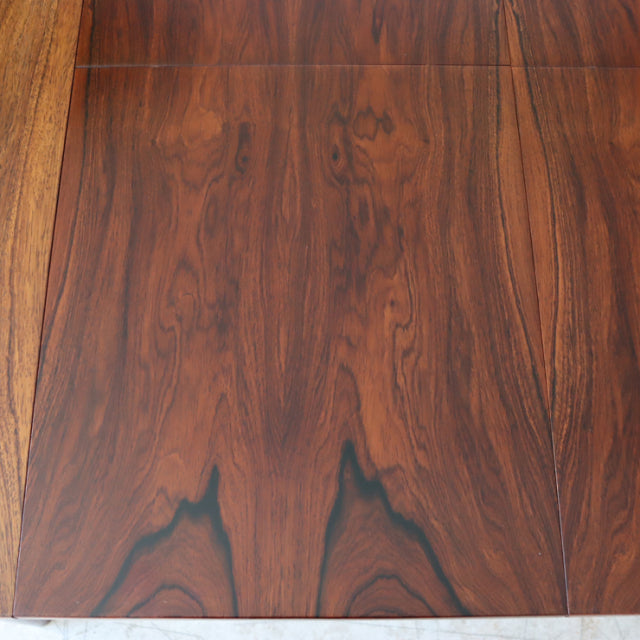 Vintage British McIntosh mid-century teak dining table top showcasing rich wood grain and smooth finish.