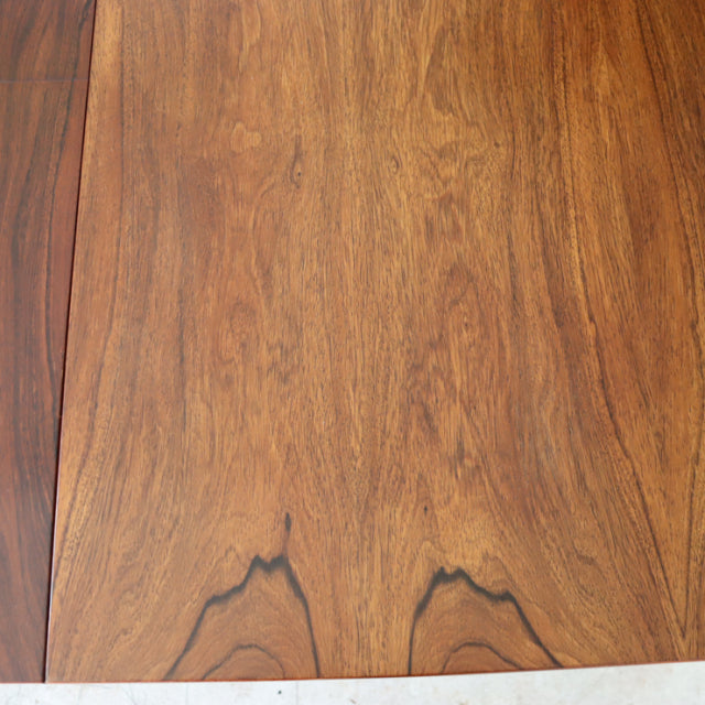 Mid-century vintage British McIntosh teak dining table with rich wood grain and rectangular top.