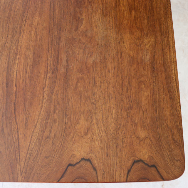 Vintage teak McIntosh dining table top with rich wood grain and smooth rounded corners, mid-century British design with.