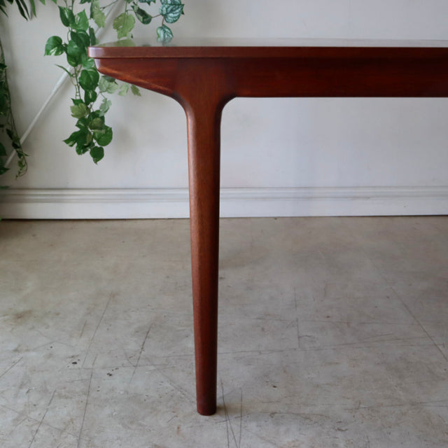 Vintage McIntosh teak dining table leg with elegant mid-century British design and smooth wood grain finish.