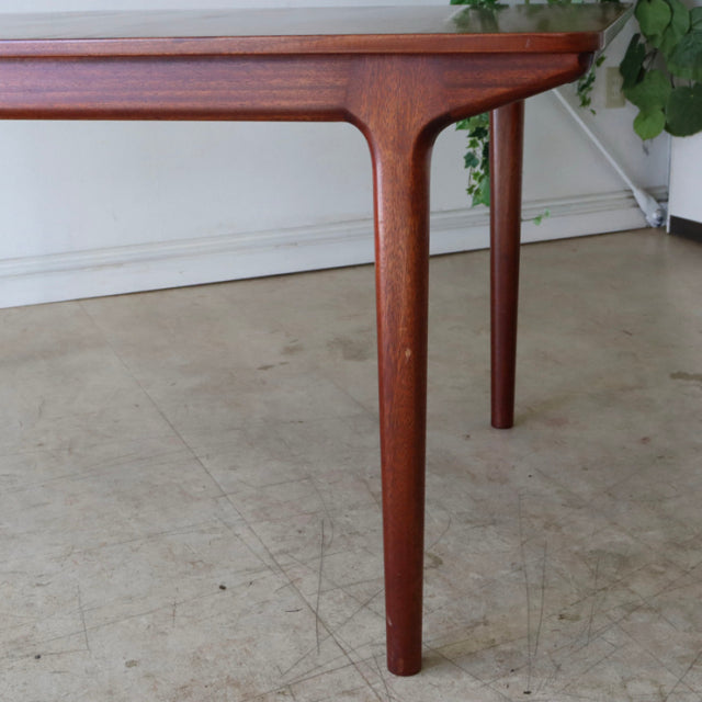 Vintage mid-century teak dining table leg with smooth British design and subtle wood grain detailing.