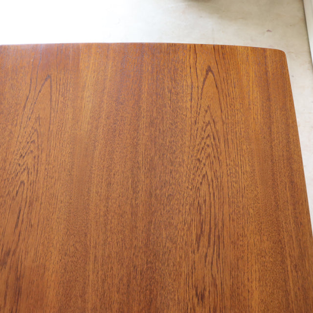 Vintage teak dining table top with rich wood grain and smooth finish, British mid-century style.