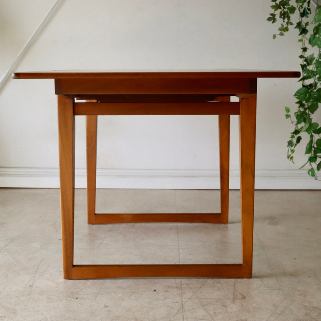 Mid-century vintage teak dining table with British-Denmark design, rectangular top, clean lines, and sturdy square legs.