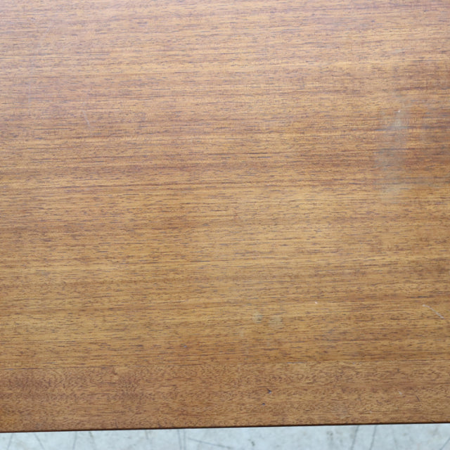 Vintage G-Plan teak coffee table top showing warm wood grain with mid-century British design influences.