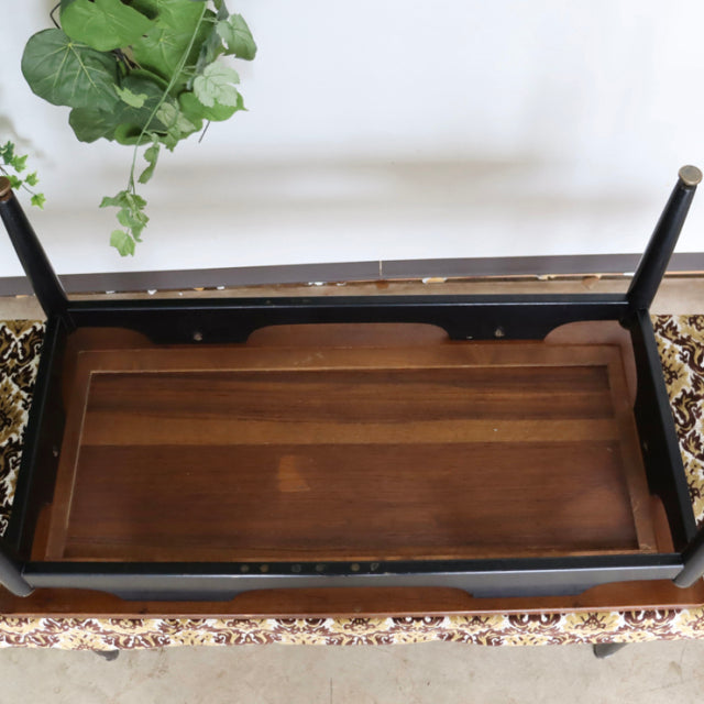 Vintage teak G-Plan coffee table with black frame, slender legs, and mid-century British design details.