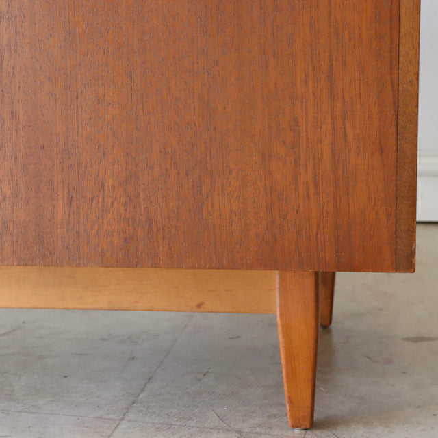 Vintage teak British mid-century storage box leg detail with warm wood grain and tapered wooden legs from Sutcliffe of.