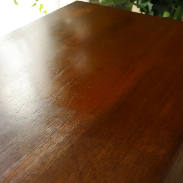 Vintage British mid-century teak storage box top with rich wood grain and smooth finish.