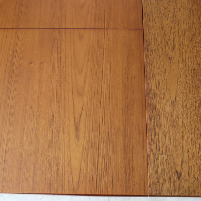 Vintage teak dining table top with rich wood grain, mid-century British design, smooth rectangular surface.