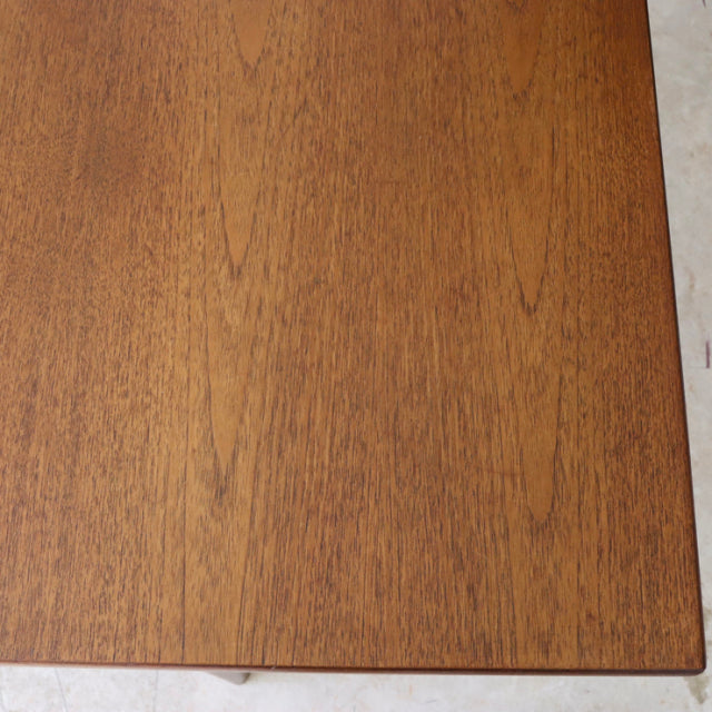 Vintage teak dining table top showcasing fine wood grain from British mid-century design by Whiteandnewton.