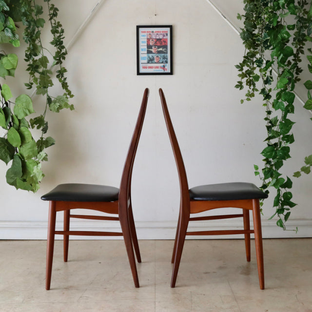 Pair of vintage Danish mid-century teak dining chairs by Koefoeds Hornslet with black upholstered seats, slender tapered.