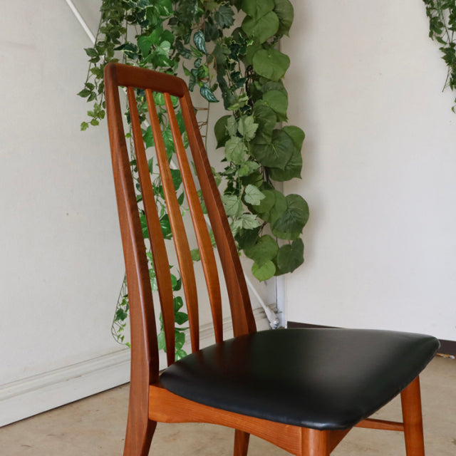 Set of two vintage mid-century Danish teak dining chairs by Koefoeds Hornslet with black leather seats and slender vertical.