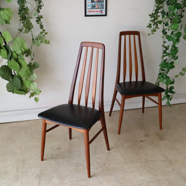 Pair of vintage mid-century Danish teak dining chairs by Koefoeds Hornslet with black leather seats and slender tapered legs.