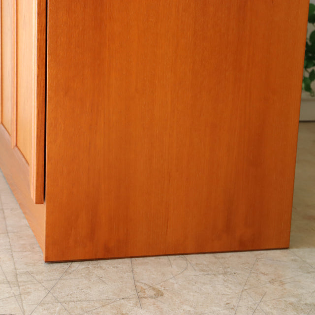 Close-up of vintage British mid-century McIntosh sideboard made from warm teak with smooth wood grain and clean, seamless.