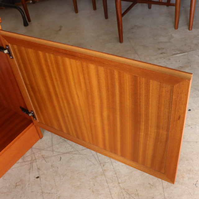 Vintage British mid-century teak McIntosh sideboard door showing rich wood grain and smooth finish.