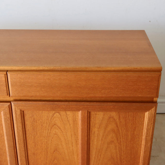 Mid-century British vintage teak sideboard by McIntosh with distinct wood grain and clean lines.