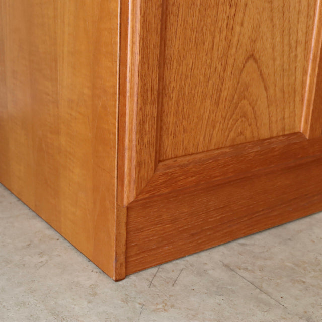 Corner detail of vintage British mid-century teak sideboard by McIntosh showing rich wood grain and clean lines.