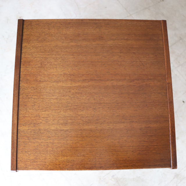 Vintage British mid-century teak bedside cabinet top with rich wood grain and clean edges.