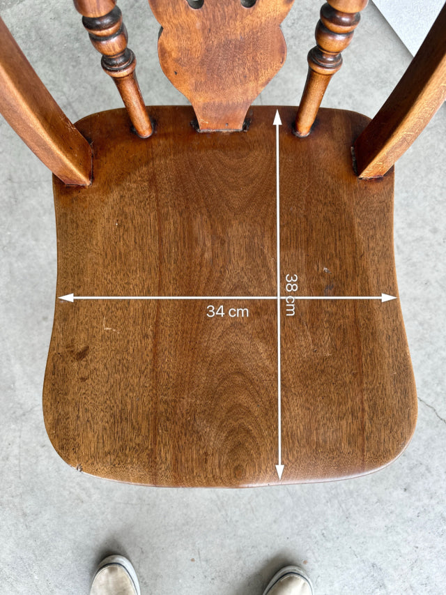 Vintage British mid-century teak kitchen chair seat with visible wood grain and curved edges, measuring 34 cm wide by 38 cm.