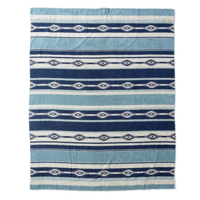 Blue and white cotton pile blanket with Native Border pattern, vintage British style.