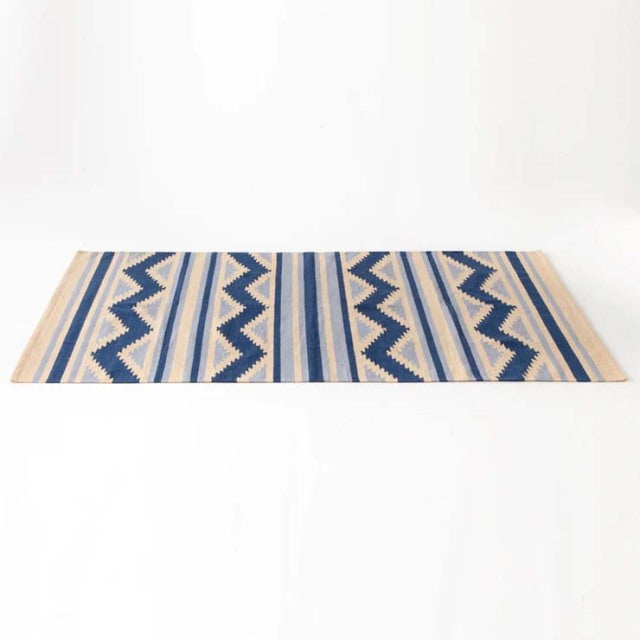 Mid-century vintage cotton rug with blue geometric patterns and beige stripes, inspired by British and Danish design.