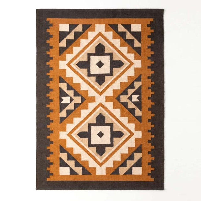Vintage mid-century cotton rug with geometric pattern in brown, black, and ochre tones, inspired by British and Danish.