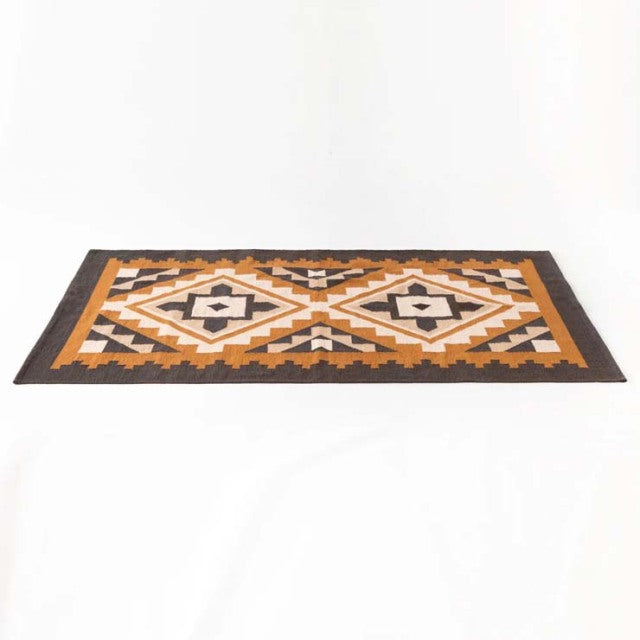 Vintage mid-century cotton rug with geometric patterns in brown, beige, white, and black, inspired by British and Danish.