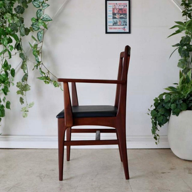 Vintage mid-century teak dining chair by Younger with British design, featuring sleek armrests and tapered legs,.