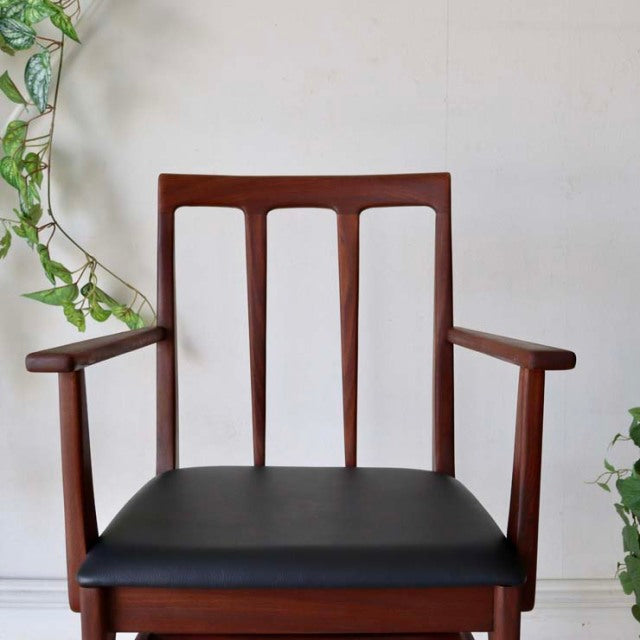 Vintage teak dining chair by Younger with British mid-century design, featuring a solid wood frame, vertical slat backrest,.