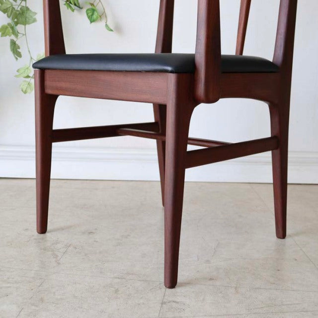 Mid-century British vintage teak dining chair by Younger with black leather seat and tapered legs.