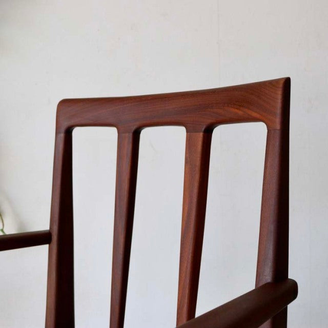 Vintage teak dining chair by Younger with British mid-century design, slender vertical slats and smooth armrests.