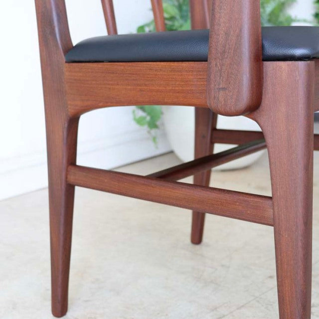 Vintage teak dining chair by Younger, British mid-century design with sleek tapered legs and armrest, black leather seat.