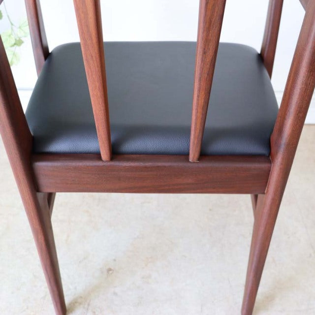 Vintage teak dining chair by Younger with black leather seat, British mid-century design by John Herbert, slender tapered.