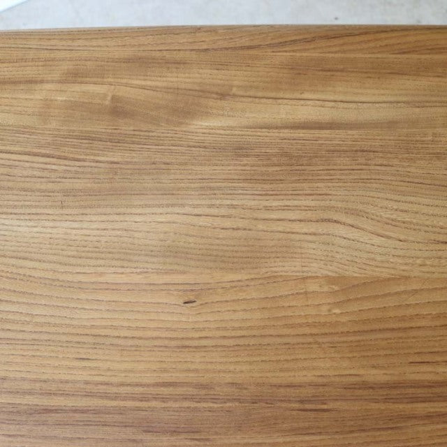 Vintage British mid-century Ercol dining table in teak wood with smooth grain and rounded edges.