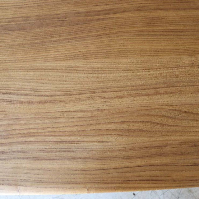 Mid-century British vintage Ercol dining table in teak with smooth grain and rounded edges.