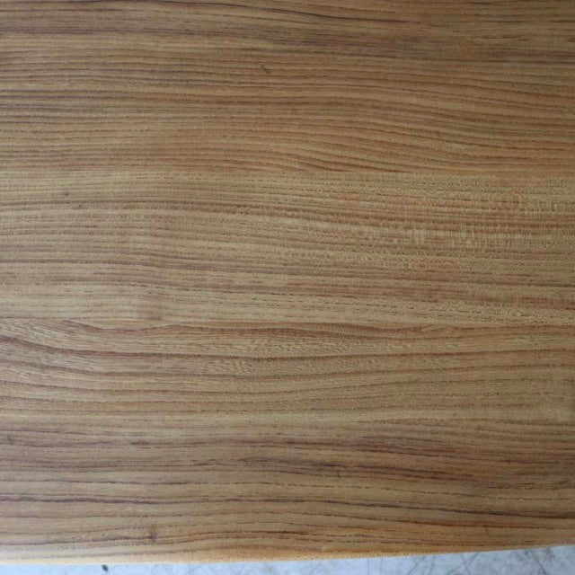 Vintage British mid-century Ercol dining table top in warm teak with distinctive wood grain patterns.