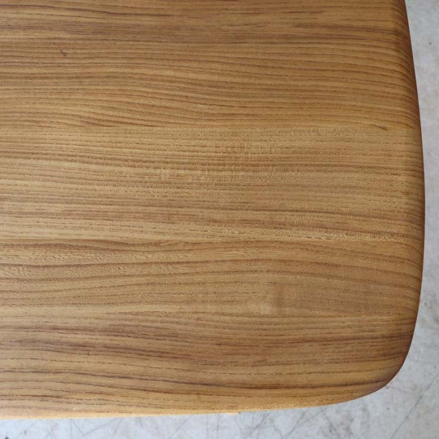 Mid-century British vintage Ercol dining table top in smooth teak with visible wood grain and rounded edges.